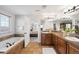 Bathroom suite with dual sinks, lots of counter space, a soaking tub, and tile floor at 17378 W 78Th Dr, Arvada, CO 80007