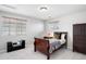 This cozy bedroom features natural light, and includes closet storage and neutral carpet at 17378 W 78Th Dr, Arvada, CO 80007