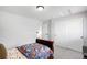 This cozy bedroom features natural light, closet storage, and neutral carpet at 17378 W 78Th Dr, Arvada, CO 80007