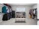 Walk-in closet with ample shelving and hanging space for organization at 17378 W 78Th Dr, Arvada, CO 80007