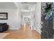 Bright entryway featuring soaring ceilings, hardwood floors, and an elegant staircase with white railings at 17378 W 78Th Dr, Arvada, CO 80007