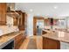 Well-appointed kitchen with granite countertops, stainless steel appliances, and ample cabinet space at 17378 W 78Th Dr, Arvada, CO 80007