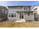 Back of home showing sliding glass doors accessing the yard at 10962 Vaughn St, Commerce City, CO 80022