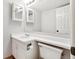 Clean, neutral bathroom with a vanity that includes an under-counter toilet paper holder at 7434 Singing Hills Ct, Boulder, CO 80301