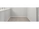 Compact dining area with a small kitchen, white cabinets, and ample space for a dining table at 7434 Singing Hills Ct, Boulder, CO 80301