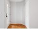 Well-lit entryway features a door to the outside and a convenient coat closet with parquet wood floor at 7434 Singing Hills Ct, Boulder, CO 80301
