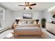 Serene main bedroom featuring a comfortable bed, stylish lamps, and a spacious layout with ample natural light at 7434 Singing Hills Ct, Boulder, CO 80301