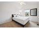 This bedroom features neutral walls, carpet, window views and ceiling fan with light at 10166 Grove Loop # D, Westminster, CO 80031