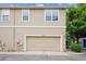 Street view of home showcasing attached garage at 10166 Grove Loop # D, Westminster, CO 80031
