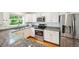 Modern kitchen with granite countertops, stainless steel appliances and natural light at 10166 Grove Loop # D, Westminster, CO 80031