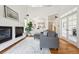 Spacious living room with open layout, vaulted ceiling, fireplace, and access to other rooms at 10166 Grove Loop # D, Westminster, CO 80031