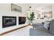 Inviting living room featuring a fireplace, plush sofa and plenty of natural light at 10166 Grove Loop # D, Westminster, CO 80031