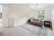 Relaxing living room with a soft couch, carpeted floor, and a window with natural light at 10166 Grove Loop # D, Westminster, CO 80031