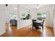 Bright living room and dining area featuring hardwood floors and neutral color scheme at 10166 Grove Loop # D, Westminster, CO 80031