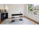 Bright home office with large window, hardwood floors and modern shelving at 10166 Grove Loop # D, Westminster, CO 80031
