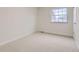 This is a bright bedroom with neutral carpet and a window view at 11864 E Idaho Dr, Aurora, CO 80012