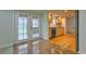 Cozy kitchenette featuring wood cabinets, French doors, and natural light at 11864 E Idaho Dr, Aurora, CO 80012