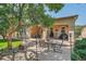 Outdoor space features a patio dining area with a table, chairs and built in lighting at 8582 E 148Th Ln, Thornton, CO 80602