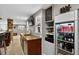 Basement bar with a beverage refrigerator, a dark wood bar, and a view to the seating at 8582 E 148Th Ln, Thornton, CO 80602