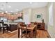 Formal dining room adjacent to the kitchen with hardwood floors and natural light at 8582 E 148Th Ln, Thornton, CO 80602