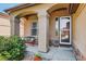 Charming front porch featuring a bench and stone accents for a welcoming entrance at 8582 E 148Th Ln, Thornton, CO 80602