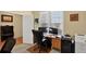 Bright, spacious office space with natural light, dual monitors, and file cabinets for efficient work at 8582 E 148Th Ln, Thornton, CO 80602