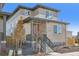 Attractive two-story home featuring stone and siding, complemented by a well-maintained front yard at 21185 E 62Nd Ave, Aurora, CO 80019