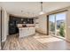 Eat-in kitchen with island and sliding glass doors at 10870 Unity Way, Commerce City, CO 80022