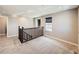 Upper landing with staircase and window offering natural light at 10870 Unity Way, Commerce City, CO 80022