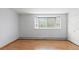 Sunlit bedroom featuring hardwood floors, a bay window and neutral color palette at 550 E 12Th Ave # 209, Denver, CO 80203