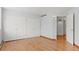Bright bedroom featuring hardwood floors, double closets, and plenty of natural light at 550 E 12Th Ave # 209, Denver, CO 80203