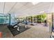 Bright fitness center with weight machines, treadmills, and large windows overlooking a peaceful outdoor space at 550 E 12Th Ave # 209, Denver, CO 80203
