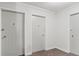 Hallway featuring white painted doors, classic door hardware, and carpeted floors at 550 E 12Th Ave # 209, Denver, CO 80203