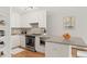 Modern kitchen featuring stainless steel appliances, gray countertops, and ample cabinet space for storage at 550 E 12Th Ave # 209, Denver, CO 80203