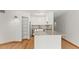 Bright kitchen with stainless steel appliances, open shelving, and plenty of countertop space at 550 E 12Th Ave # 209, Denver, CO 80203