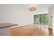Spacious living room with hardwood floors and sliding glass doors leading to a balcony at 550 E 12Th Ave # 209, Denver, CO 80203