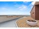 Spacious roof deck with scenic city and mountain views, stone accent, and landscaping at 550 E 12Th Ave # 209, Denver, CO 80203