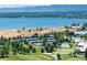 Aerial view of community with lake, tennis courts, and golf course at 6100 W Mansfield Ave # 24, Denver, CO 80235