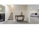 Basement hallway with half-table and access to finished areas at 6100 W Mansfield Ave # 24, Denver, CO 80235