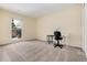 Spacious bedroom with a window and carpeted floor at 6100 W Mansfield Ave # 24, Denver, CO 80235