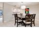 Dining area with dark wood table and chairs, near kitchen at 6100 W Mansfield Ave # 24, Denver, CO 80235