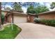 Brick ranch home with attached garage and landscaped yard at 6100 W Mansfield Ave # 24, Denver, CO 80235