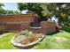 Pinehurst Village sign with landscaping and brick wall at 6100 W Mansfield Ave # 24, Denver, CO 80235