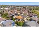 Aerial view of a neighborhood featuring mature trees and well-maintained lawns at 8487 S Nelson St, Littleton, CO 80127