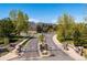 Gated entrance to a community with manicured landscaping and mountain views at 8487 S Nelson St, Littleton, CO 80127