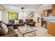Finished basement living room area with bar, furniture, staircase and projector screen at 8487 S Nelson St, Littleton, CO 80127