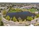 A scenic pond surrounded by mature trees and greenery, creating a peaceful and natural setting at 8487 S Nelson St, Littleton, CO 80127
