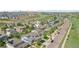 A home is marked with a locator pin in this neighborhood aerial view with mature trees and manicured lawns at 16226 W 94Th Dr, Arvada, CO 80007