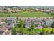 Aerial view captures homes with solar panels, well-kept lawns, and neighborhood streets with mountain views at 16226 W 94Th Dr, Arvada, CO 80007