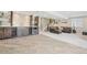 Finished basement with a custom bar area, a spacious living room and carpeted floors at 16226 W 94Th Dr, Arvada, CO 80007